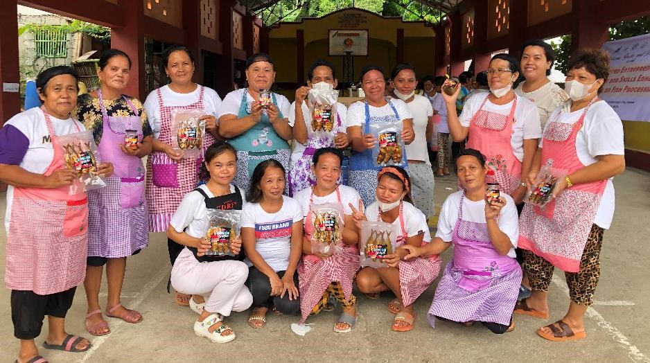 Group photo Members of Bagongon Women Association Showing their finished products – smoked fish and bottled gourmet sardines
